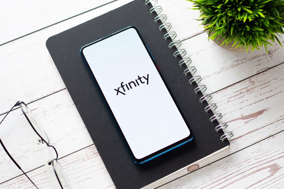 The xfinity logo on a phones screen